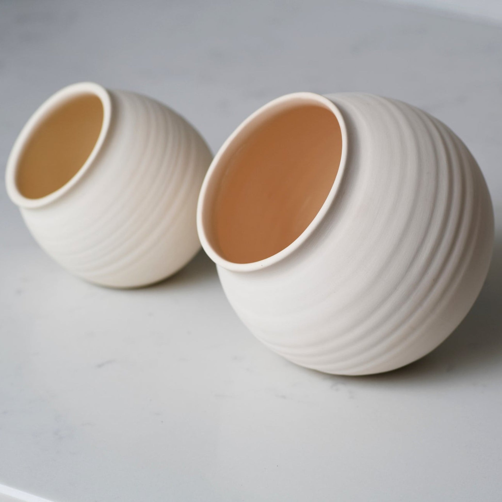 Large and small handmade ceramic salt cellars
