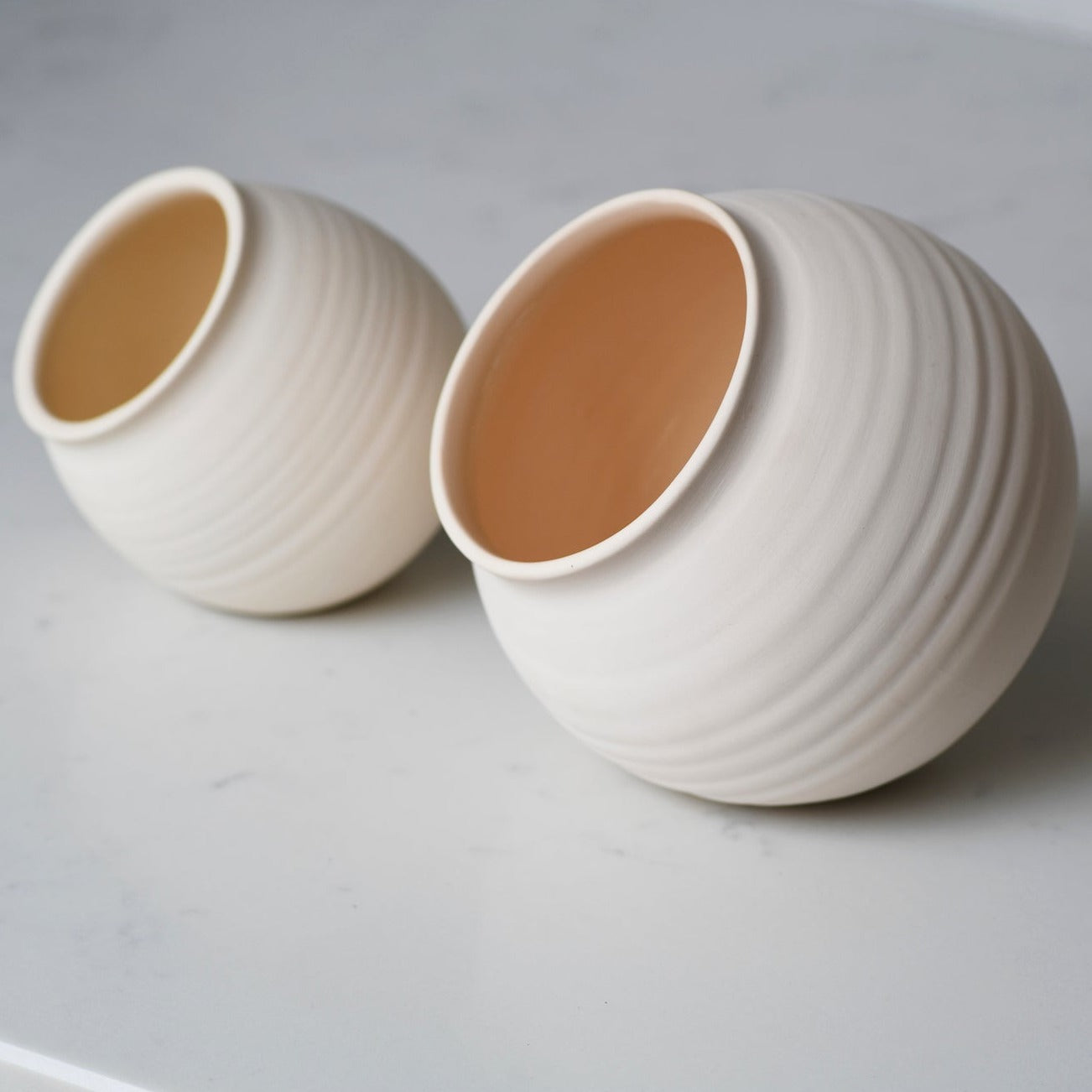 large and small handmade ceramic salt cellars